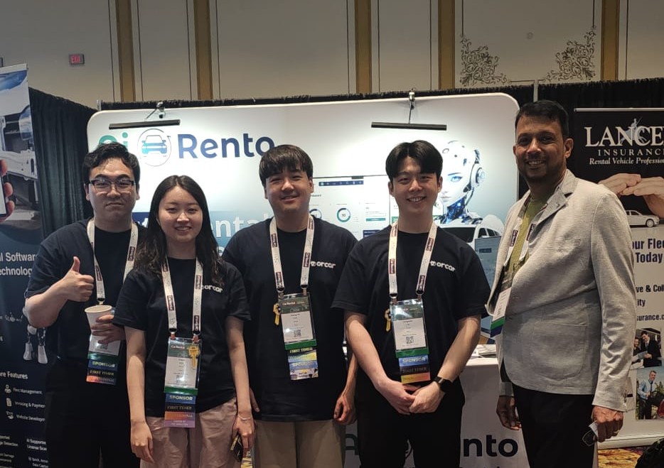 Full team photo at AiRentoSoft tech conference booth